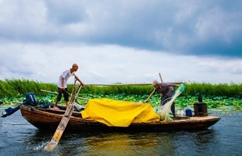 In pics: eldest fishman couple at Baiyangdian Lake